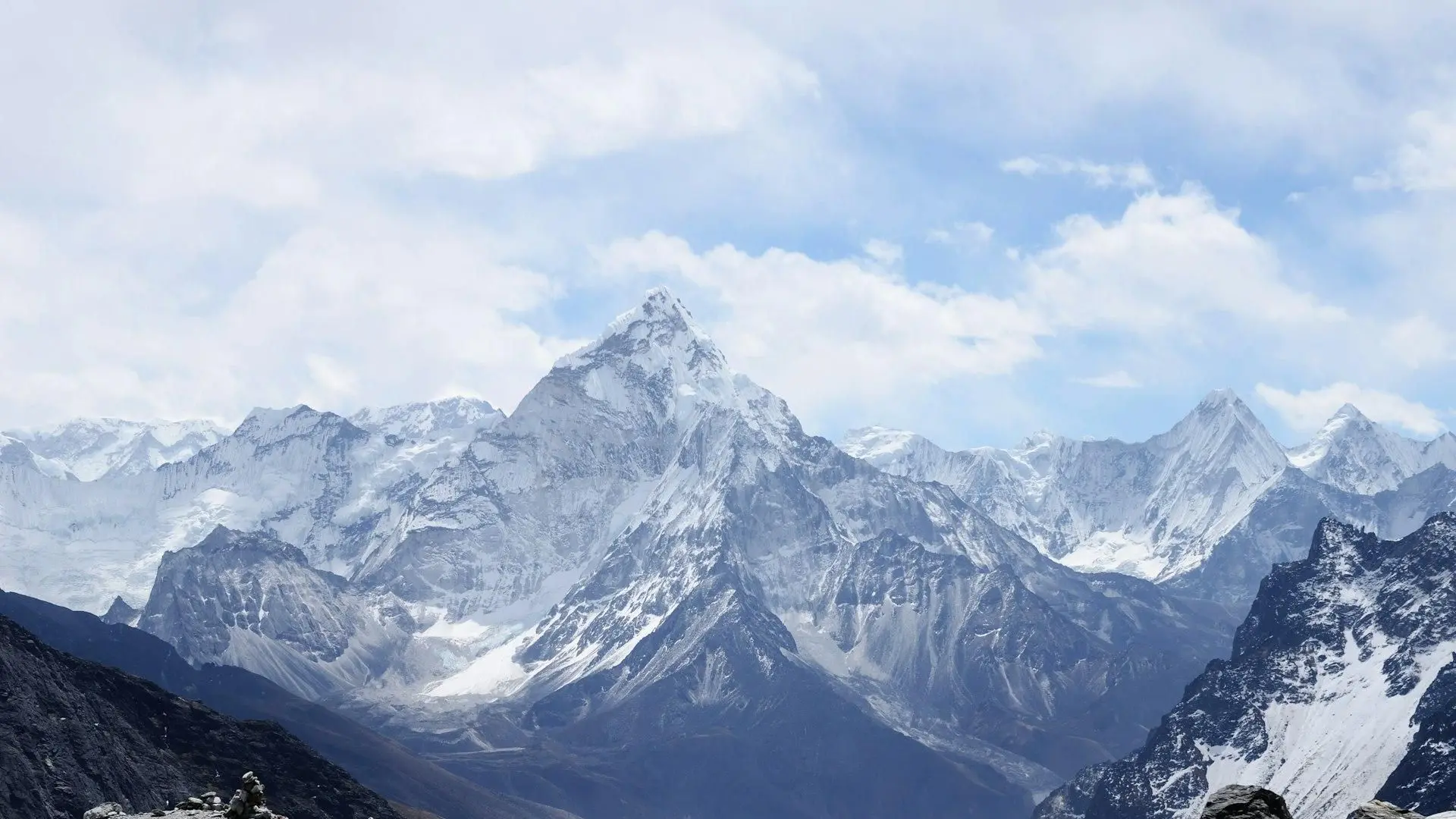 Snow-covered mountain peaks under a clear alpine sky